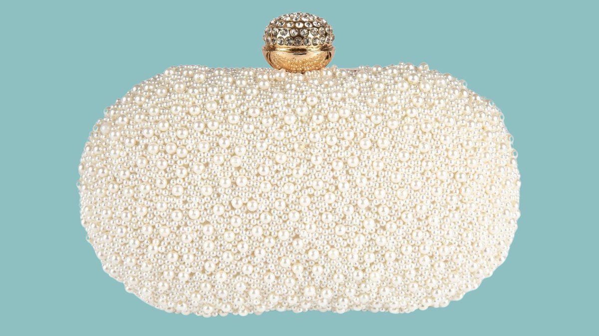 This chic, pearl beaded minaudière with crystal snap closure is an iconic look back to an LBD or almost anything in your closet. Shoulder chain included.  
#fashion #pearlclutch #accessories #bridal #minaudiere #eveningbag #handbagaddict #eveningwear #weddings #motherofbride