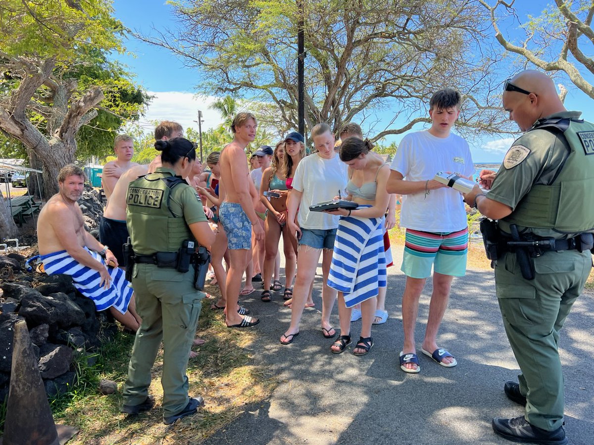 dlnr's tweet photo. DLNR Division of Conservation and Resources Enforcement (DOCARE) officers initiated cases against a large group of swimmers actively pursuing a pod of dolphins in Hōnaunau Bay Sunday morning, during a routine patrol in the South Kona District. https://t.co/wNfuzXb0dm