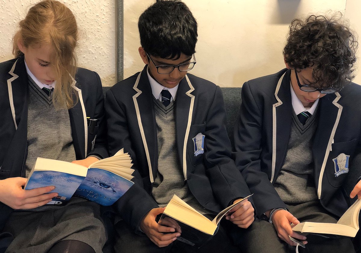 Year 7 pupils enjoy some quiet reading time in the library #getcaughtreading