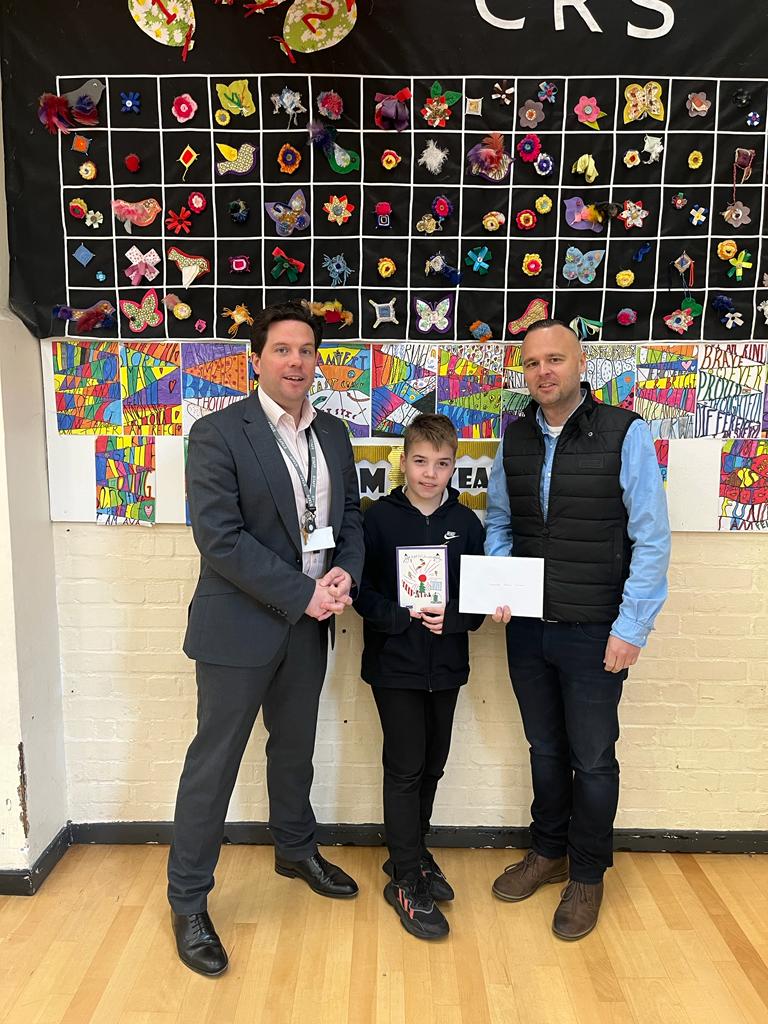 Coombe Road Primary School pupil, Preston, submitted a fantastic design for our Christmas card competition, and now, we've met him! 

It was great for our MD James to visit the school to give Preston and headteacher, Mr Scrace, their £500 vouchers for school supplies.