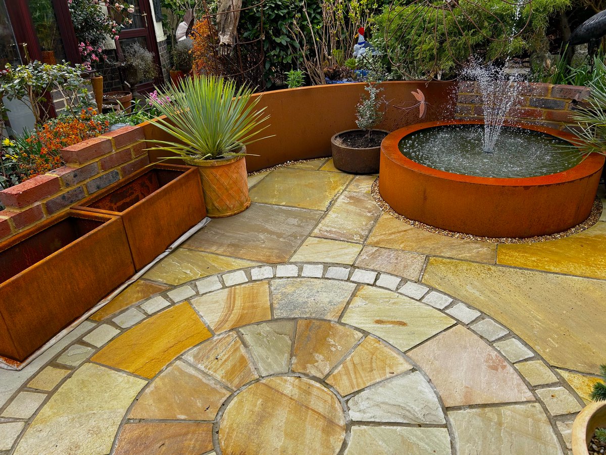 driftwoodbysea's tweet photo. Loving my corten steel collection, planters (London Stone) curved wall (Paving Superstore) and raised circular pond (Parker &amp; Coop) This area is going to look gorgeous once planted up for summer. https://t.co/jaAgFAiIcy #sussex #gardening https://t.co/jeLxsFoEZ9