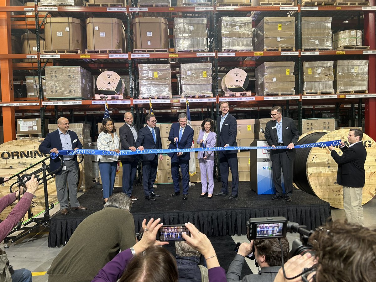 N.C. Gov. Roy Cooper and U.S. Secretary of Commerce Gina Raimondo join Corning officials in cutting the ribbon on the company’s new manufacturing facility in Hickory.