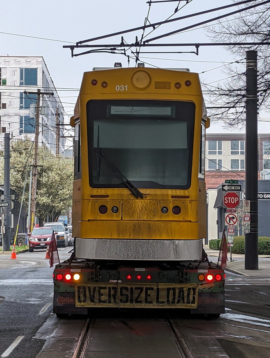 Truck carrying new streetcar.