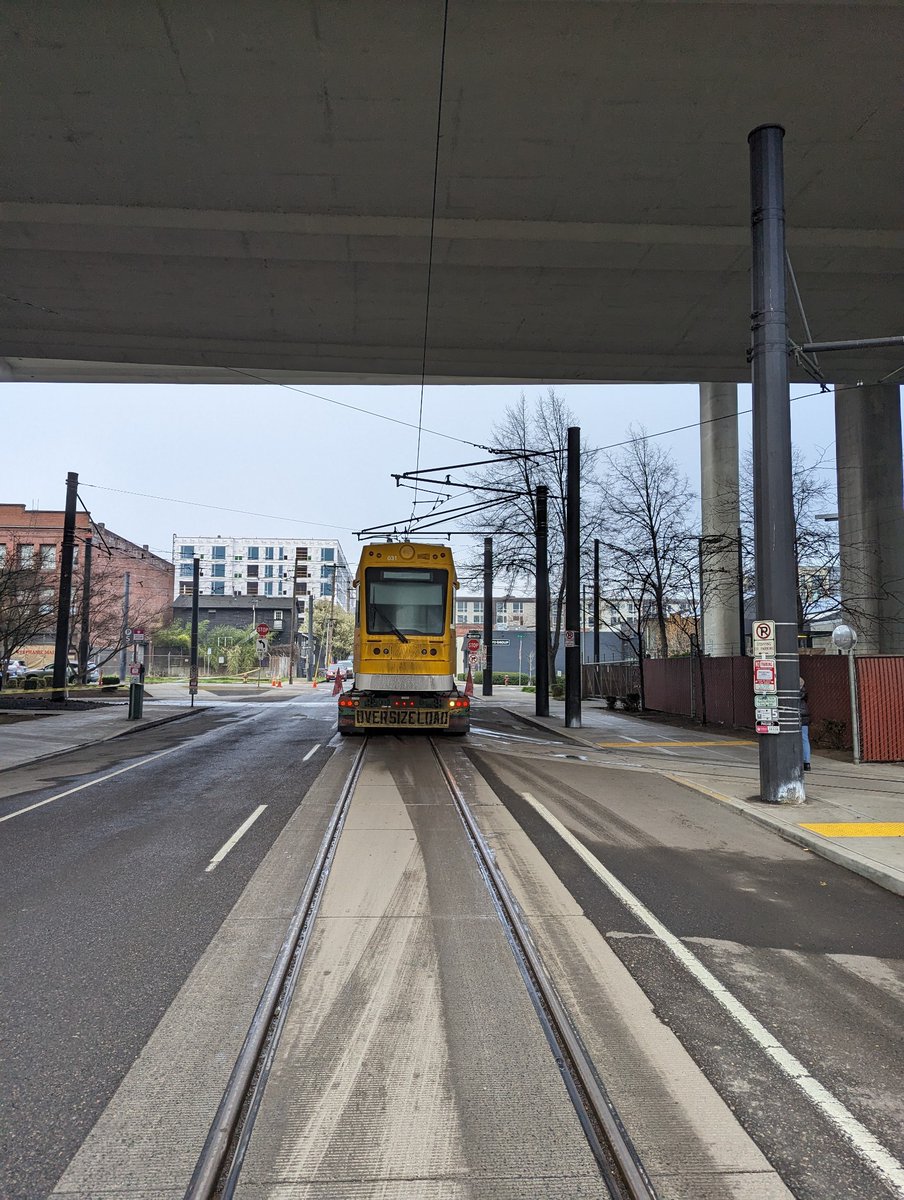 Truck carrying new streetcar.