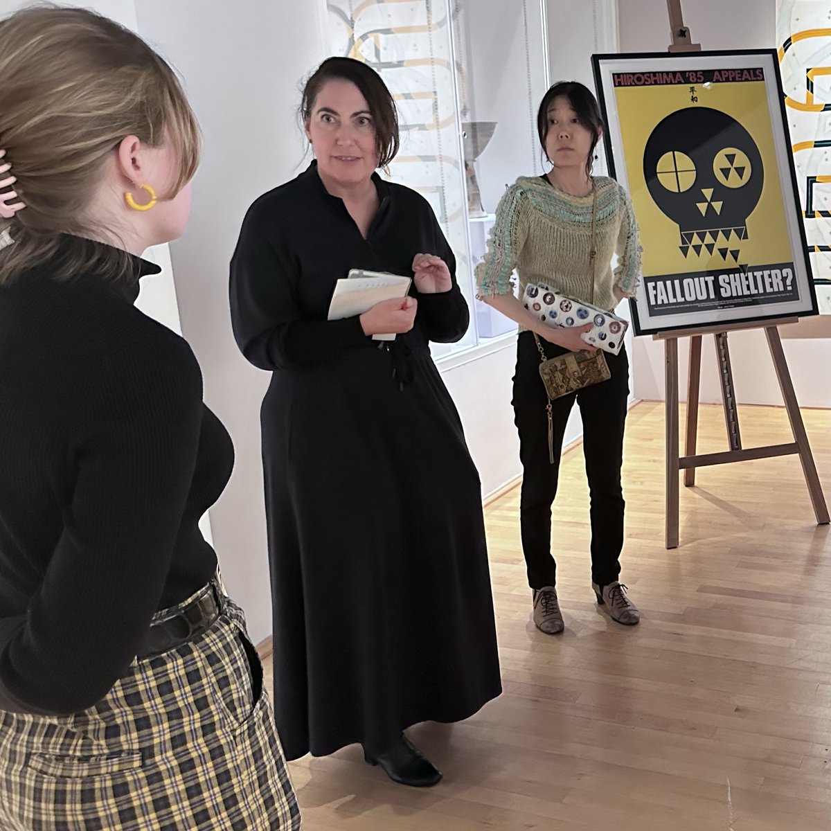 UMDArtGallery's tweet photo. Prof. Alicia Volk & her graduate seminar "No More Hiroshimas! Art & the Atomic Bomb” stopped by the Herman Maril Teaching & Research Gallery this week to view selections from our "Poster Weapons for Peace " collection. #artsforall #permanentcollection @UofMaryland @umd_arhu https://t.co/mBTAmlBZXH