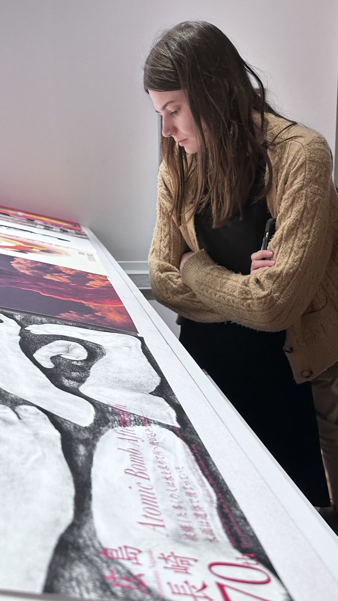 UMDArtGallery's tweet photo. Prof. Alicia Volk & her graduate seminar "No More Hiroshimas! Art & the Atomic Bomb” stopped by the Herman Maril Teaching & Research Gallery this week to view selections from our "Poster Weapons for Peace " collection. #artsforall #permanentcollection @UofMaryland @umd_arhu https://t.co/mBTAmlBZXH