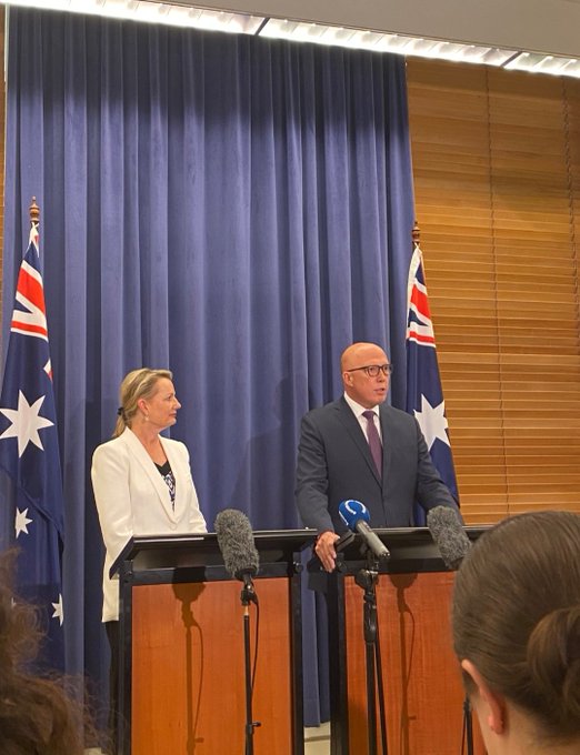 randlight's tweet photo. During yesterdays presser did we notice that the Aboriginal flag and the Torres Strait Island flag were ditched??? What a statement  plus the white jacket! https://t.co/0kz8KMHCwt