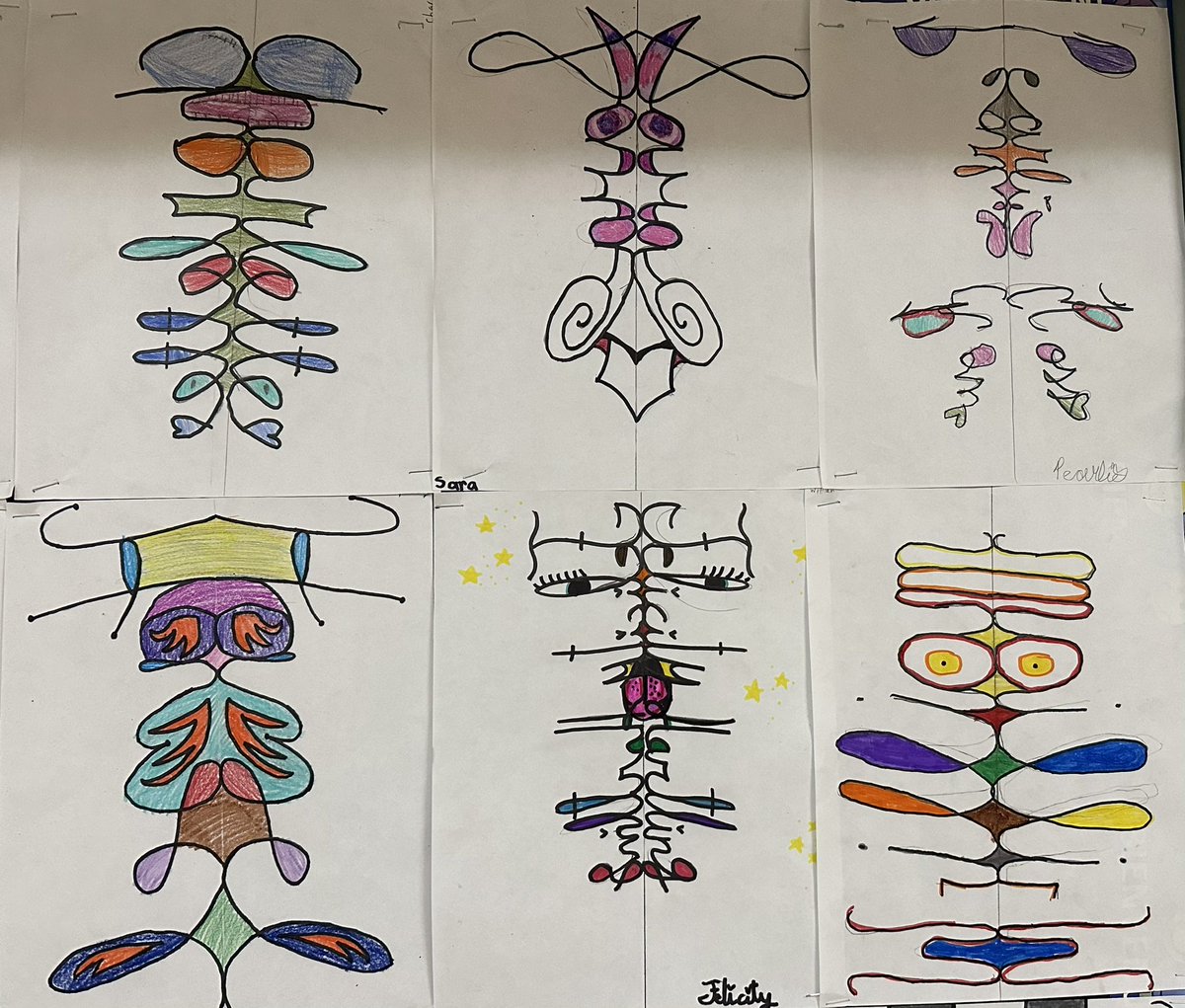 MmeMartinaH's tweet photo. Student: I didn’t know that math could actually be fun sometimes 🤣. Students have written their names in cursive, drew a line down the middle, used a Mira to reflect to the other side and traced their name again. #symmetryart #grade4math @stcatschool https://t.co/7TD0joXASK