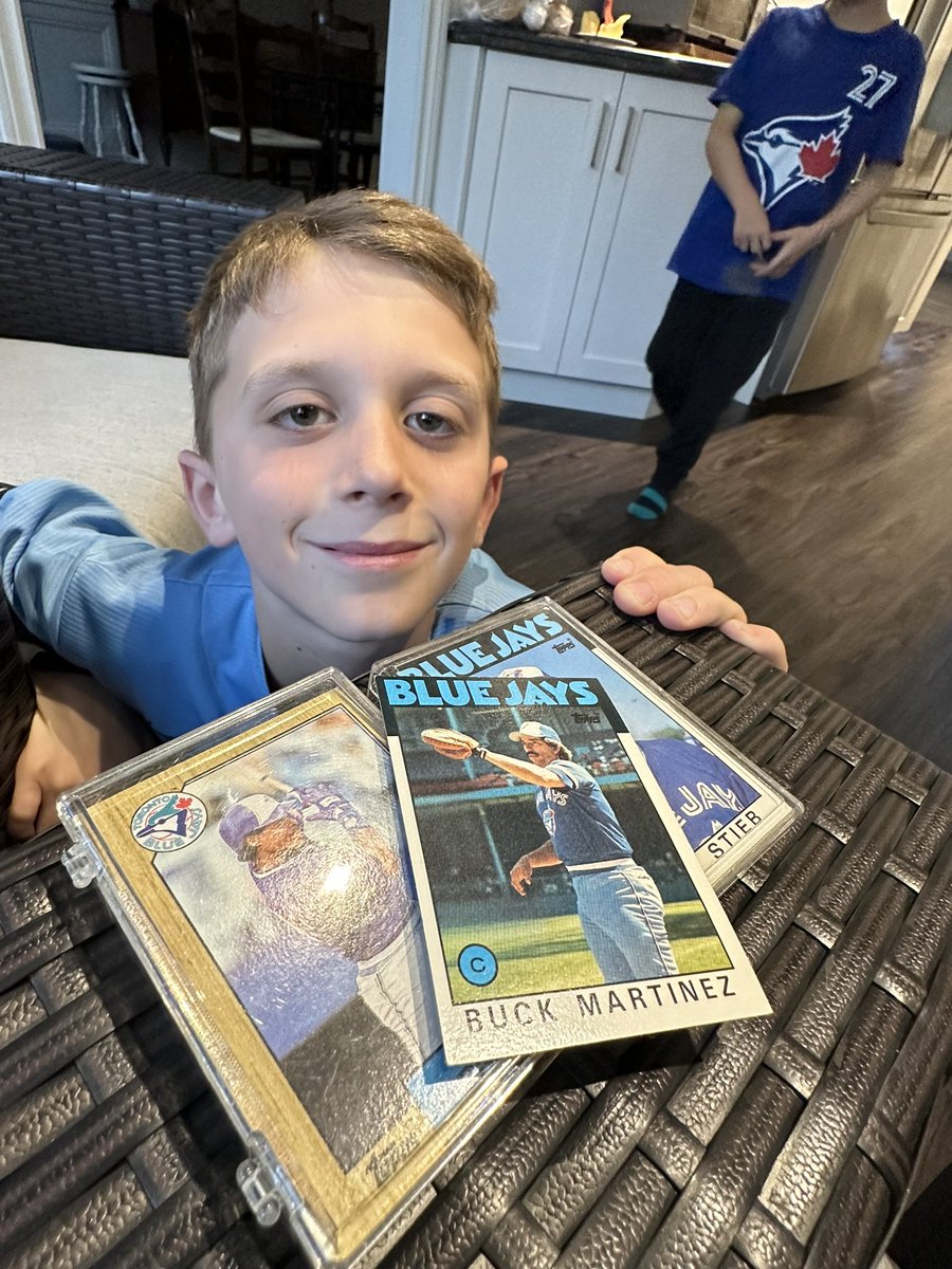 andrealdailey's tweet photo. Hey @BuckMartinez look what we found tonight! My husband has kept this since 1985 and our little aspiring baseball player is loving seeing you on TV each night! @BlueJays @Sportsnet https://t.co/XexTuEEeYT