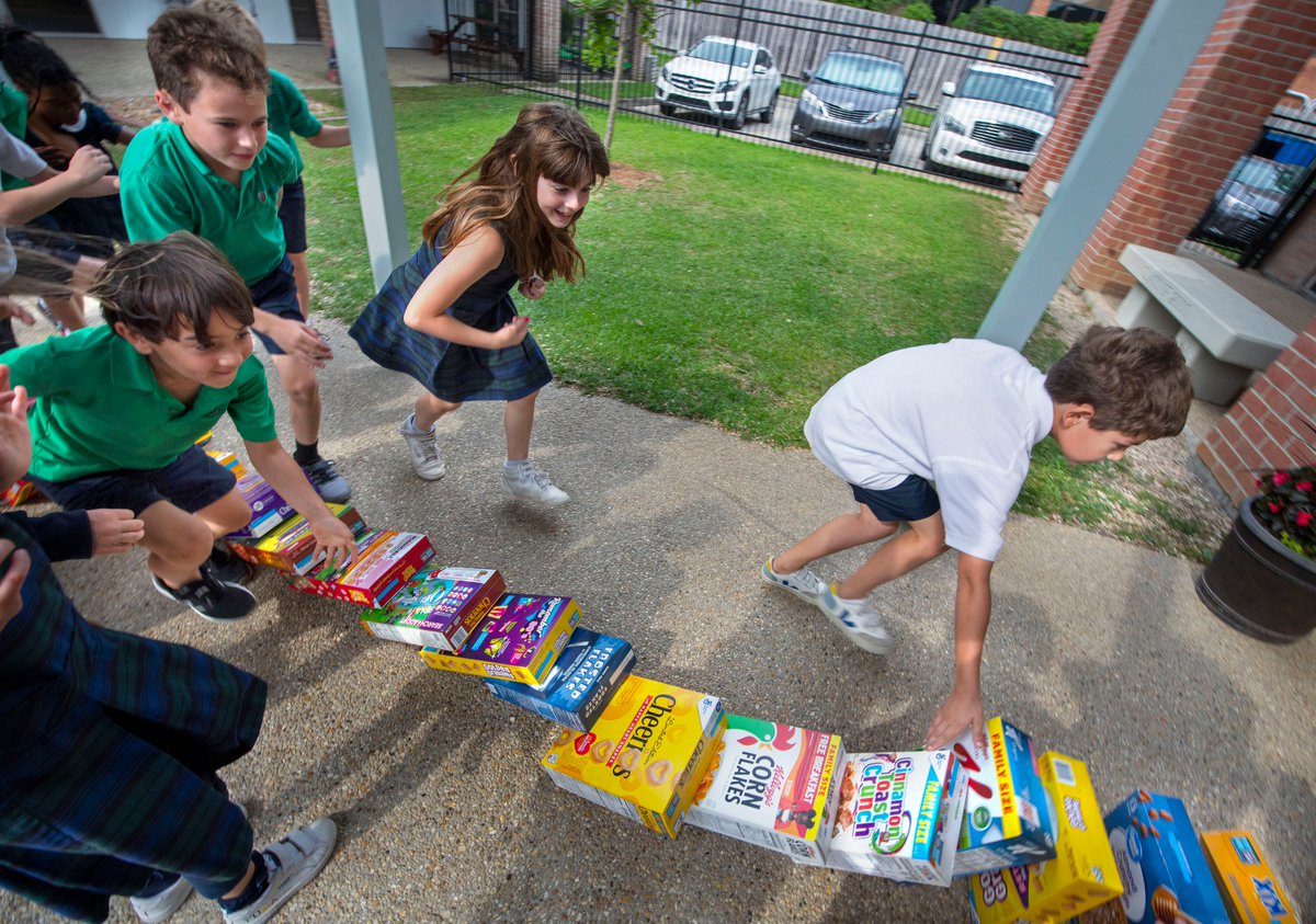 TravSprad's tweet photo. Advocate photos: Cereal boxes, 1,154 of them in all, fall like dominoes in St. Luke's Episcopal School event benefiting the Greater Baton Rouge Food Bank, April 5, 2023. @theadvocatebr @brfoodbank @stlukes_br https://t.co/F0OV5hTBVG https://t.co/PXkn7Zgyut