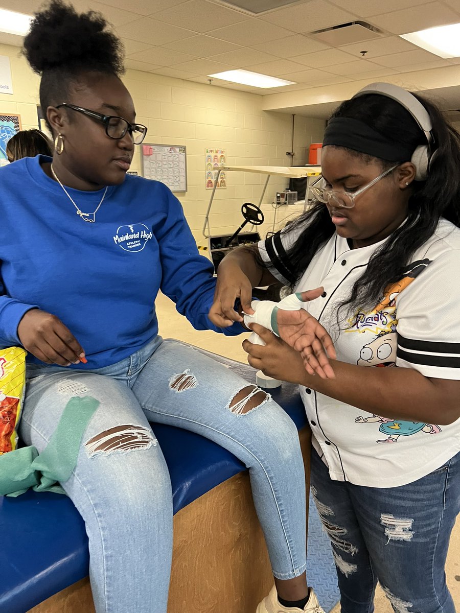 Love seeing my veteran ATSAs mentor and teach the rookie ATSAs about taping! Preparing for spring football season 👏🏼 <a href="/HilarieBlum/">Hilarie Blum</a> <a href="/TheMainlandHSFB/">Mainland High School Football</a> <a href="/mmfraine/">Missy Fraine</a> <a href="/Mainlandhigh/">Mainland High School</a> <a href="/cte_mainland/">Mainland CTE</a> @VolusiaCTE
