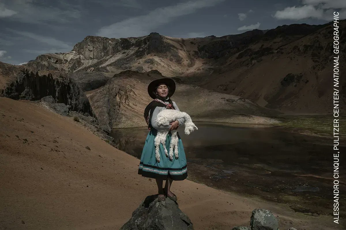 Photo of the Day | Alina Surquislla Gomez cradles a baby alpaca on the way to her family’s summer pastures, in Oropesa, Peru. <a href="/cinque_ale/">Alessandro Cinque</a>, awarded in the #WPPh2023 Contest, tells the intertwined story of culture, identity and environment. Read more: bit.ly/40q7zD0