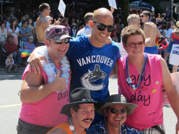 LRonSedlbauer's tweet photo. Manny Malhotra posing with fans at the 2012 Vancouver Pride Parade, Georgia Straight, 08/02/2012 https://t.co/unFC1eyZLj