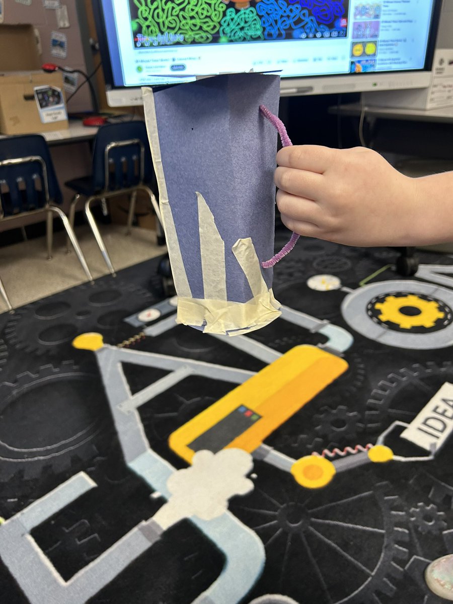 Using the design process to make a container to hold the most weight using only the materials provided.
