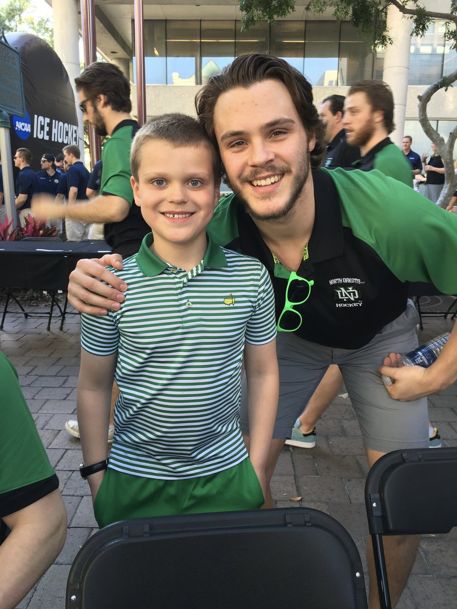 DoctorSpang's tweet photo. @Gausmus47 Curious to see % of Gopher fans @ Amalie Arena. I may be wrong, but guessing it won’t rival us UND fans from 2016! 💚 (Photo of #20 &amp; our son - now 9th grade &amp; 6’2”!) https://t.co/ZywgpRVhSN