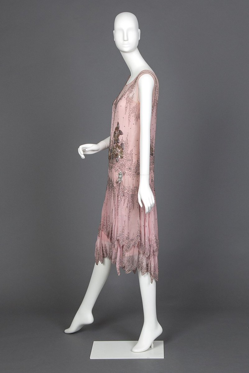 LaurenCDeutsch's tweet photo. Today's #ootd in #Cherryblossompink is this 1927 pink chiffon evening dress embroidered in beads, gold spangles, silver balls, and rhinestones. It has a gorgeous two tried scalloped hem and dropped waist. #goldsteinmuseumofdesign #Fashionhistory https://t.co/6uj3qN4ZkU