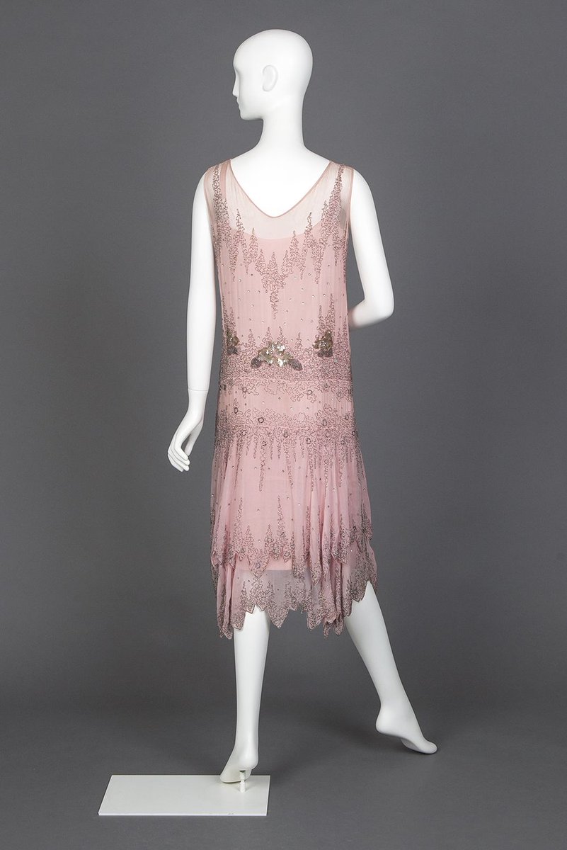 LaurenCDeutsch's tweet photo. Today's #ootd in #Cherryblossompink is this 1927 pink chiffon evening dress embroidered in beads, gold spangles, silver balls, and rhinestones. It has a gorgeous two tried scalloped hem and dropped waist. #goldsteinmuseumofdesign #Fashionhistory https://t.co/6uj3qN4ZkU
