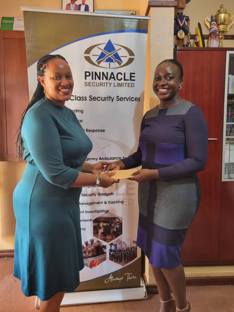 PinnacleSecEA's tweet photo. #HappeningNow @PinnacleSecEA Director Priscilla Matsiko &amp; the Quality Assurance &amp; Quality Control Manager Giel Pretorius hand over 4Million UGX to Patricia Ogule @pnaava of @UgAutism to support the core virtue of #AutismAcceptance &amp; Inclusion of persons with #Autism in #Uganda https://t.co/rLypjXqoJb