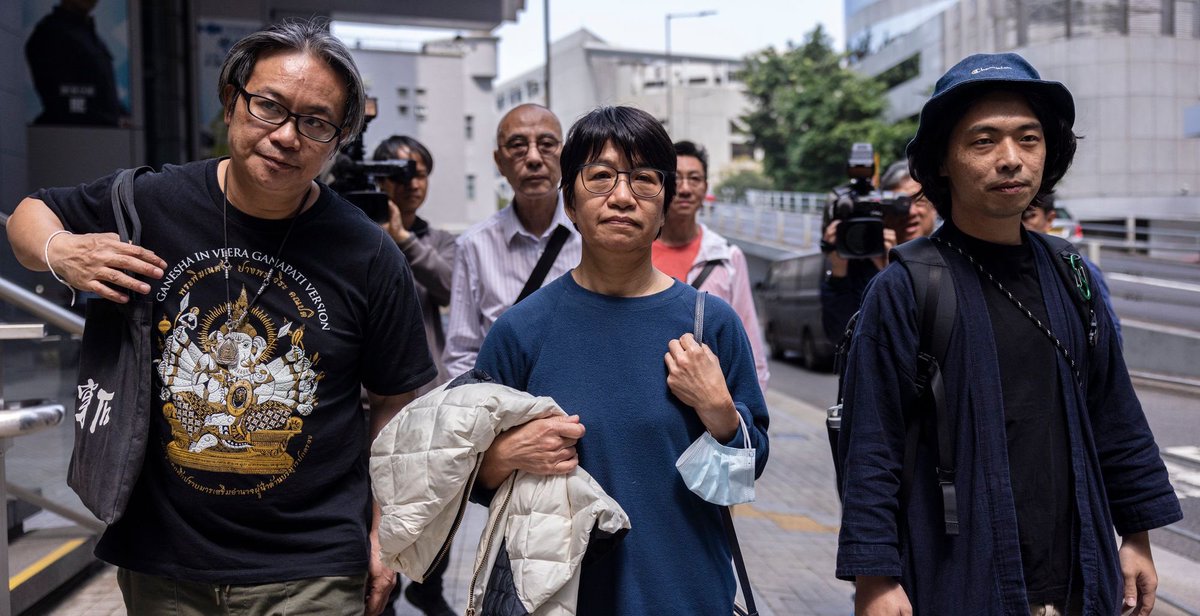 hkdc_us's tweet photo. A striking @louisededel photo of #ElizabethTang emerging from a #HongKong police station on Mar 11 flanked by union colleagues. Arrested after visiting her husband #LeeCheukYan in prison, she was released but is barred from leaving the bigger prison of HK. https://t.co/238bTewFhO https://t.co/XmySLDSmtC