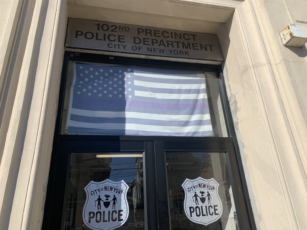StreetsblogNYC's tweet photo. This flag greets visitors or complainants @nypd102pct in Richmond Hill. What do you think of that ⁦@NYPDPC⁩? #First15 https://t.co/8xSK0SYisi