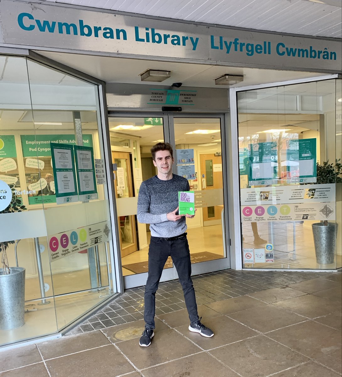 MrEPrimary's tweet photo. Calling all teachers in Cwmbran! Be sure to stop by Cwmbran Library and borrow my book, 100 Ideas for Primary Teachers: Reading for Pleasure 📗💚! This library is where my love for children's books and passion for reading for pleasure began as a child growing up and later on when working there as an employee, and now it's an honour to come full circle and sign stock of my book which the library has so kindly ordered in. I couldn't believe my eyes when I saw it displayed on the 'New' shelf, right by the legendary @MichaelRosenYes! So grateful for their support and what a surreal feeling! @TorfaenLibrary #100Ideas #ReadingForPleasure @BloomsburyEd
