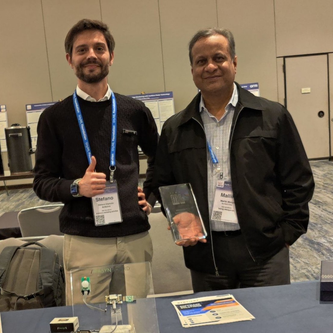 Syntiantcorp's tweet photo. Did you know? We WON “Best Product of the Year” for our NDP200 at this year's tinyML Summit! 

Pictured: Our CBO Mallik Moturi holding the @TinymlF  award standing next to Stefano Implicito of @arduino.   Click https://t.co/OkmM1sE7af to learn more.  #tinyML #edgeAI #NDP200 #AI https://t.co/Cwl9NpCQBk