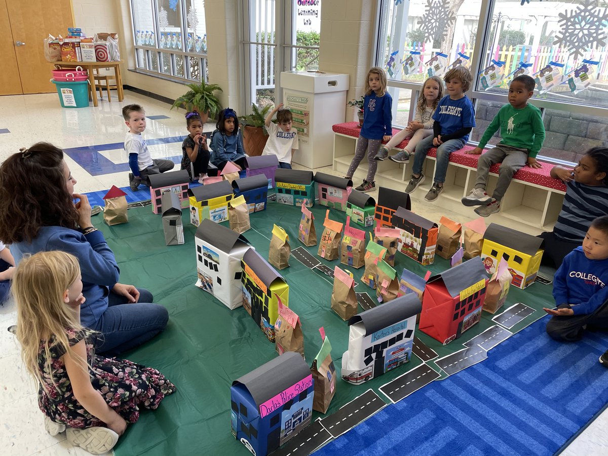 After learning about buildings and towns, our Pre-K4 students created their own town and we absolutely 💙 it!!

First, they built houses, public service facilities and businesses. Then they created the roads and added signs.