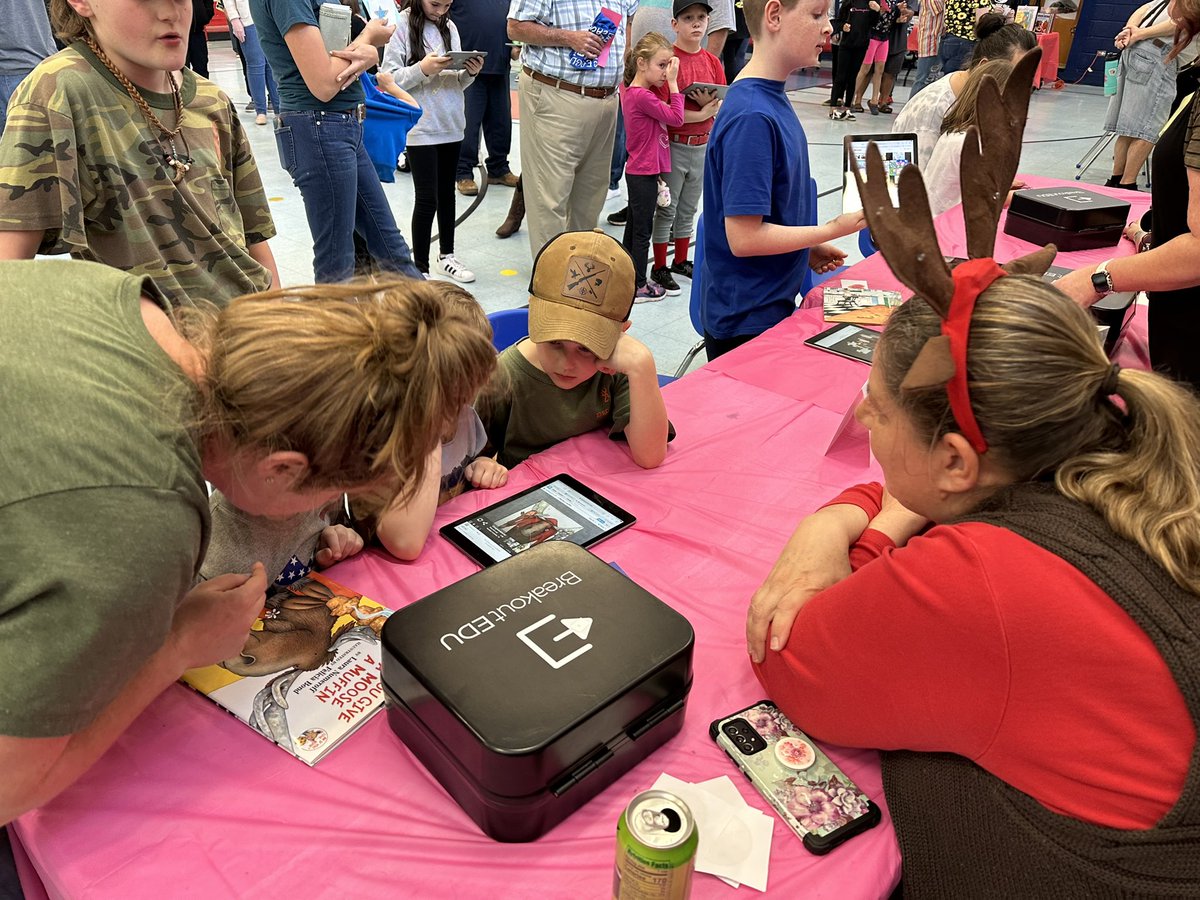 bmoody33's tweet photo. @ghes_eagles celebrating One Book One District with @breakoutEDU and Beebots!  Family Reading Night is rocking! #ignitelearningbcps #ALLIN @BurkeCoSchools https://t.co/Oj5ujs7qly