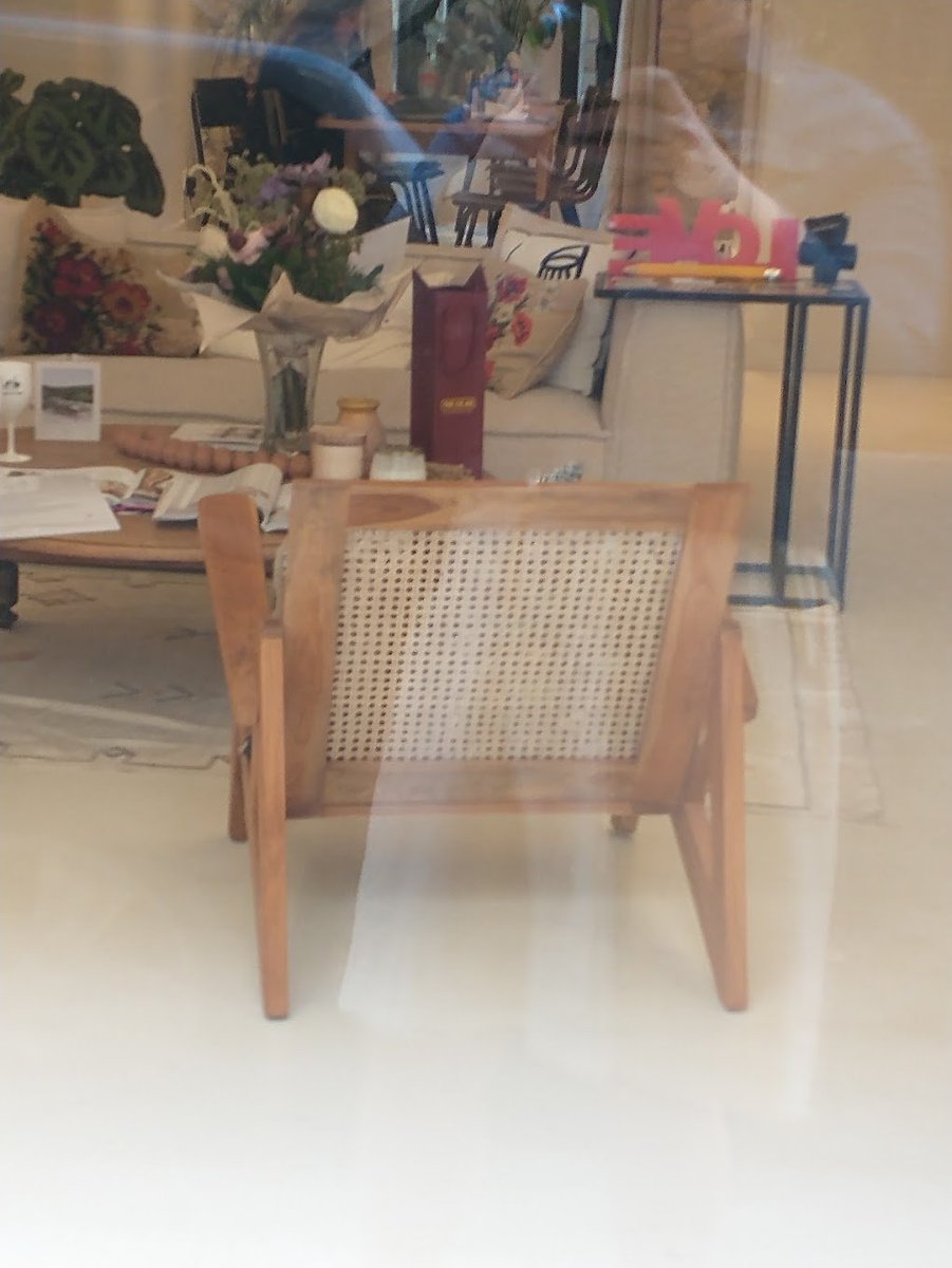 I spy with my little eye....a suspiciously similar looking wood and caned chair in a real estate office in Nice, France.