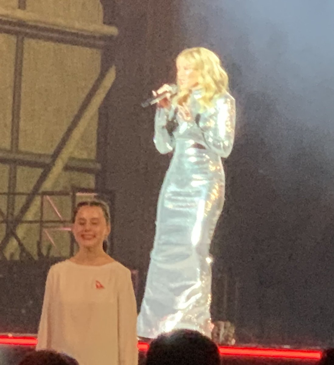 AnthonyTravelEd's tweet photo. Kylie Minogue the surprise guest at tonight’s Qantas 100th anniversary dinner at Sydney Airport. Her opening song? The less surprising Qantas anthem, ‘I Still Call Australia Home’. @TravellerAU @qantas https://t.co/3WhuzghL8n