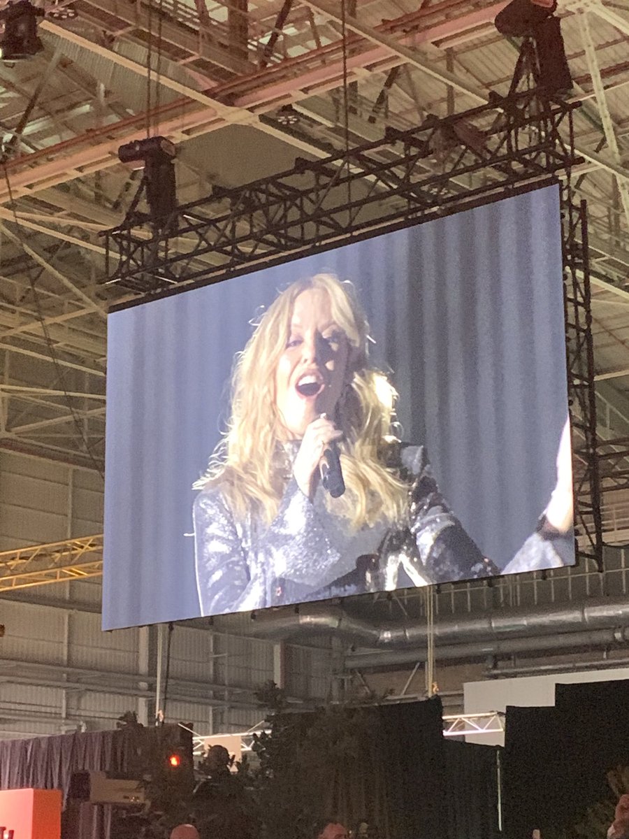AnthonyTravelEd's tweet photo. Kylie Minogue the surprise guest at tonight’s Qantas 100th anniversary dinner at Sydney Airport. Her opening song? The less surprising Qantas anthem, ‘I Still Call Australia Home’. @TravellerAU @qantas https://t.co/3WhuzghL8n
