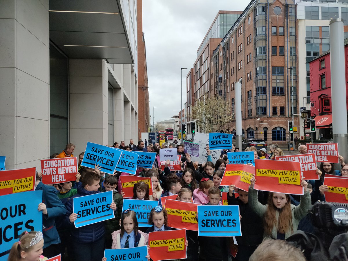 WestBelfastPB's tweet photo. Children from 51 schools in West Belfast and our colleagues from North Belfast protesting outside the @NIOgov against brutal cuts to our vital education services! 

#SaveOurKids 
#FabKids https://t.co/coP74Iqt5I