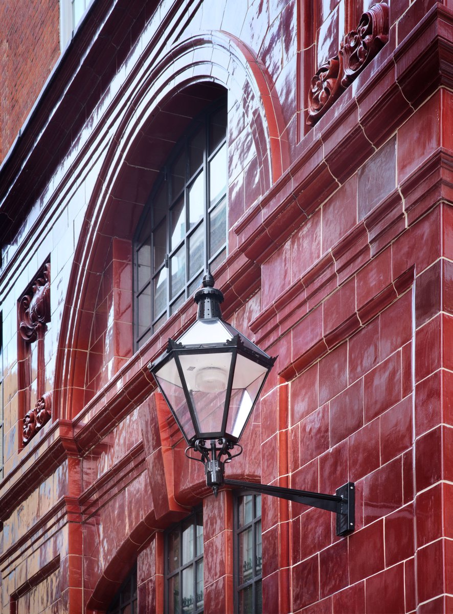 Oxblood red tiles, iron lanterns and arched windows are just some of the evocative architectural features of our new office development One Hooper’s Court.