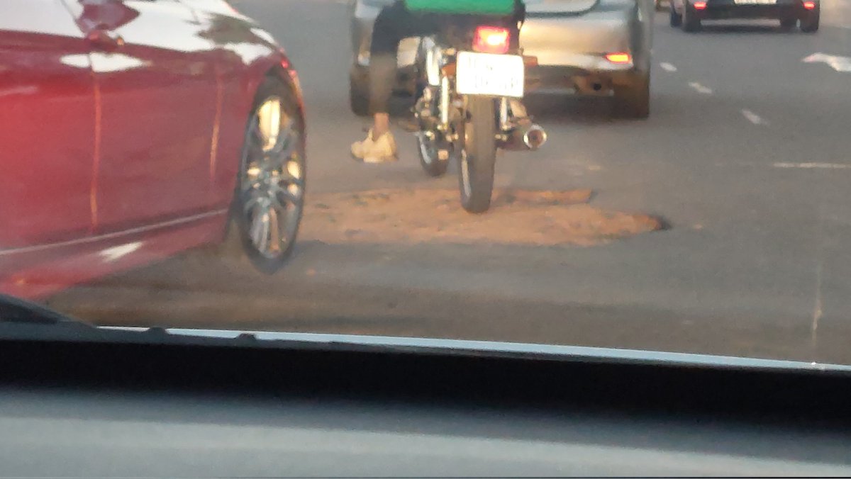 Fab_Queen_'s tweet photo. @CityofJoburgZA can this huge pothole at the corner of Oxford Road and Melrose Road, close to the Engen Garage please be fixed.  This picture only covers half of the pothole. I started a new job in February and this hole has been there and just getting bigger. https://t.co/wAoo5j49zS