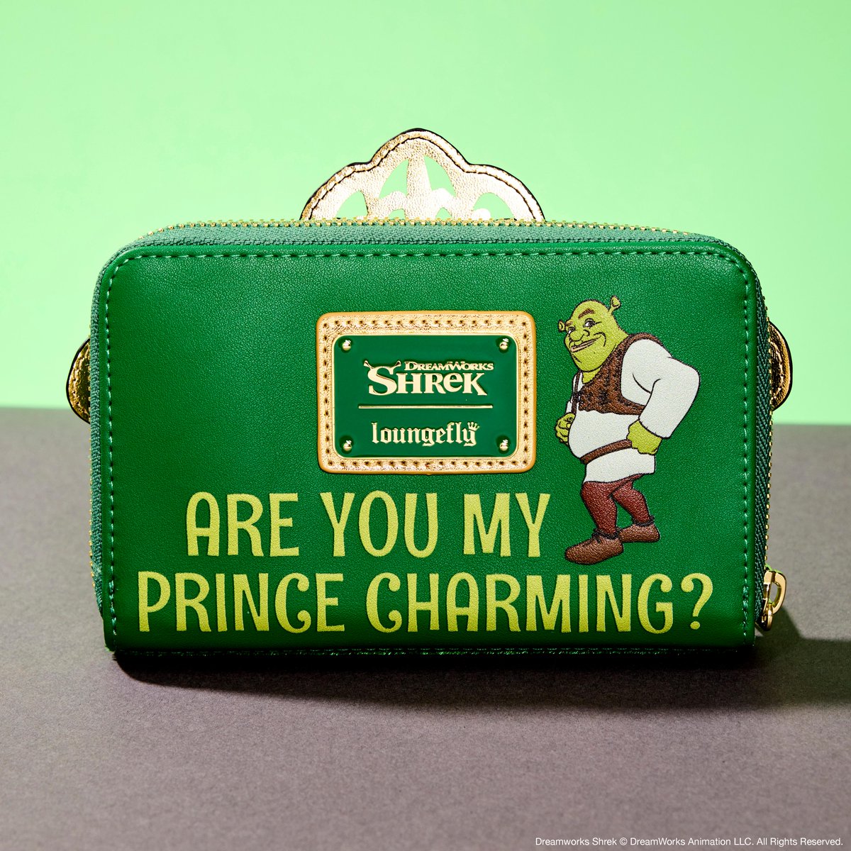 Dreamworks's tweet photo. A fairy tale come to life! Live your Far Far Away dreams with this new #Shrek collection from @Loungefly – including Princess Fiona exclusive mini backpack and wallet! Available now: https://t.co/VMiK25amf3 https://t.co/O9Kys7YHaZ