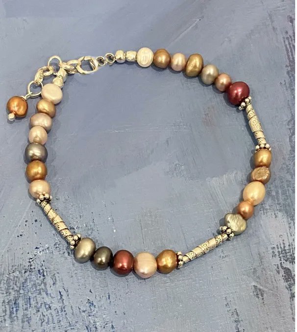 Picture this pearl and silver bracelet stacked with you other favorite silver and leather bracelets. I promise you it elevates the look! We call it the Indian Summer Bracelet on line at pamolderdesigns.com