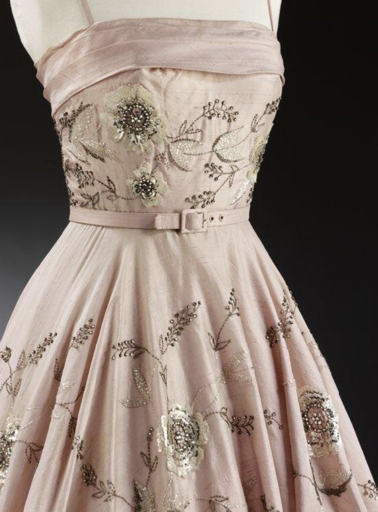 LaurenCDeutsch's tweet photo. This week's #FridayFrills in #Cherryblossompink is this 1955 evening dress designed by Owen Hyde Clark for Worth. It's made of a pink silk dupion embroidered in sequins, pastes, and crystal beads into floral patterns. @V_and_A #Fashionhistory https://t.co/rvhXiZh3PS