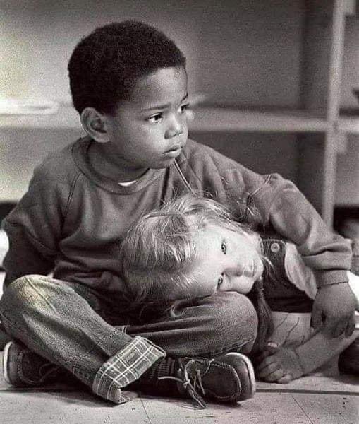 RandyResist's tweet image. Credit: Marco Mancinelli: “I had been on assignment at a Detroit Montessori school for two days, and shot hundreds of photos. Some were very good, but I knew I hadn't gotten THE shot. That afternoon, as we all sat on the floor in a circle listening to a story, I bowed my head.…