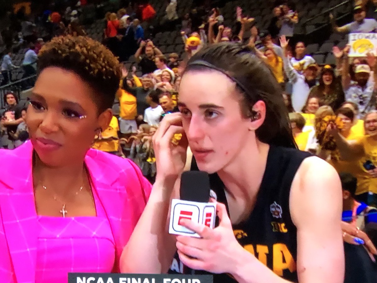 Jeff4water's tweet photo. Monica McNutt of #ESPN is the best!  In the heat of the moment she shares her earpiece with Caitlin Clark saving the end of game interview. https://t.co/jY5kWCZWhd