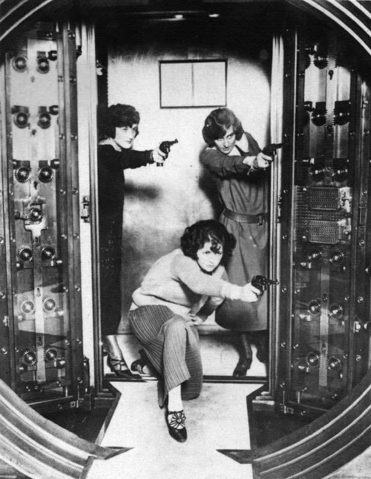SkrticX's tweet photo. Female workers practice protecting the main vault of the strong room at the Cleveland Trust Company, Ohio, 1924. https://t.co/v0QdTUCG4b