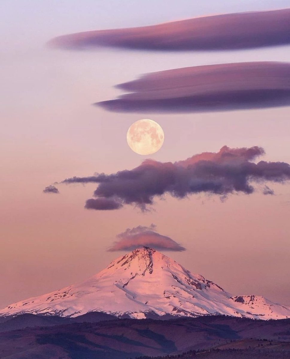 Full moon over Mount Fuji.