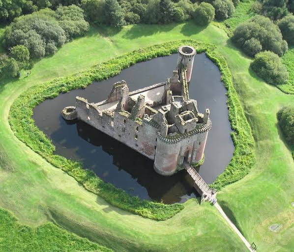 Caerlaverock Castle near Dumfries, Scotland.

Maxwells repaired and upgraded Caerlaverock over years. Impressive machicolations (slotted defenses) at top of each tower date from late 1300s or early 1400s, by which time Wars of Independence with England had taken their toll.