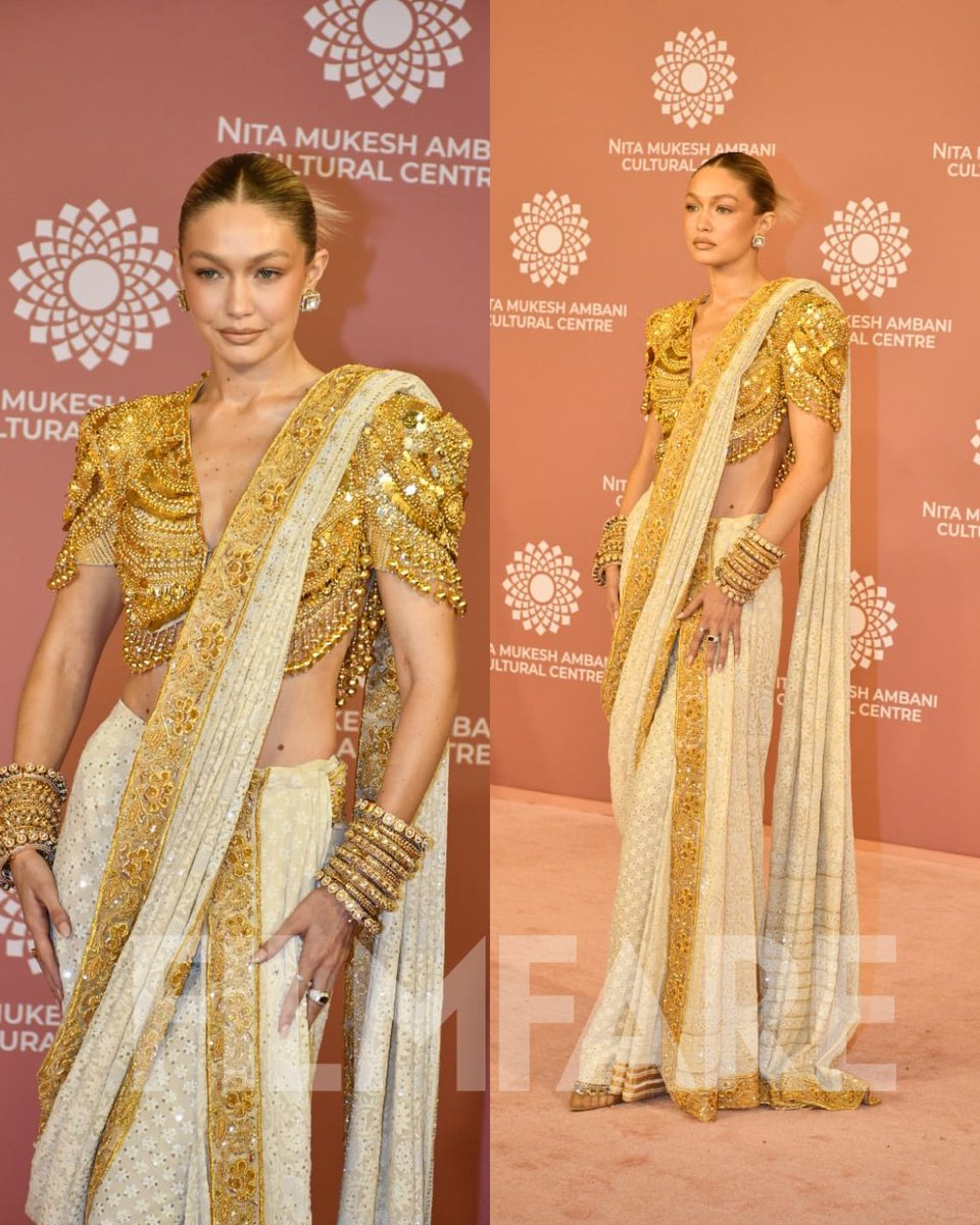filmfare's tweet photo. Dripping in gold! ✨️

#GigiHadid arrives for Day 2 celebrations of the opening of NMACC hosted by Isha Ambani. https://t.co/jia5PGgGFq