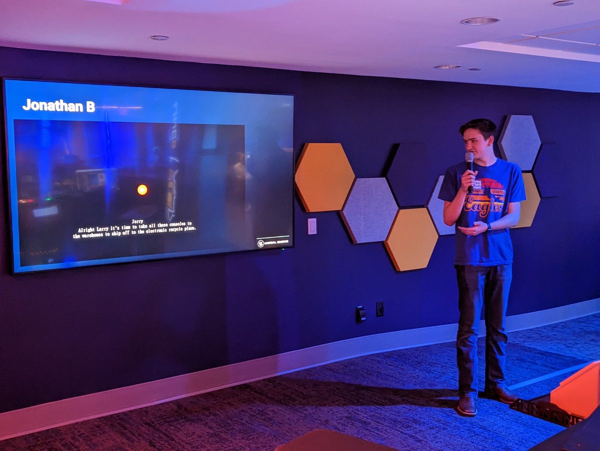 UCAGameDev's tweet photo. Juniors Jonathan and Gannon presenting their Epic E-waste animation challenge videos to a room full of NC animation teachers #EaglePride #UCAGameDev https://t.co/YMQQOMpiV5