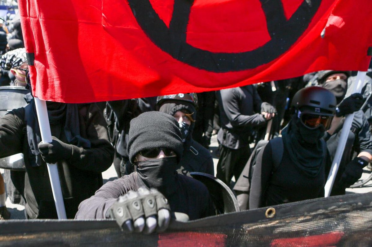 DeMureDeb's tweet photo. Can someone explain to me how this group Antifa is above all our laws.  How they are allowed to go around masked and terrorizing Canadians? https://t.co/xWwmlDUhiy