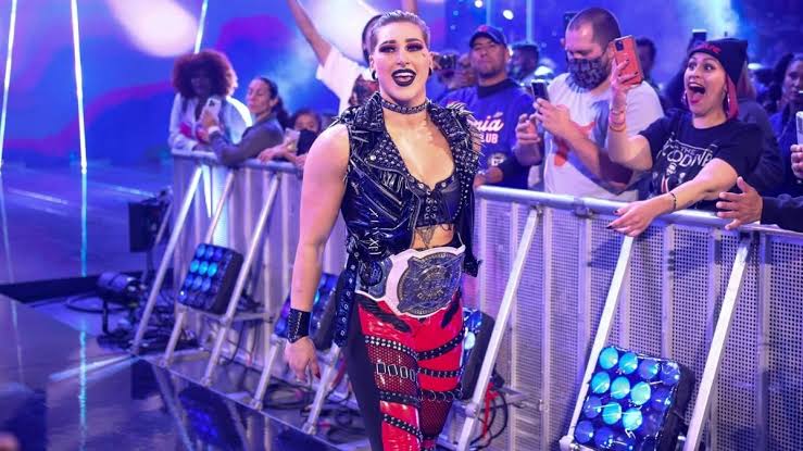 SKWrestling_'s tweet photo. GRAND SLAM RHEA!! ⚖️
#WWE #WrestleMania #RheaRipley https://t.co/gxrffRQHsU