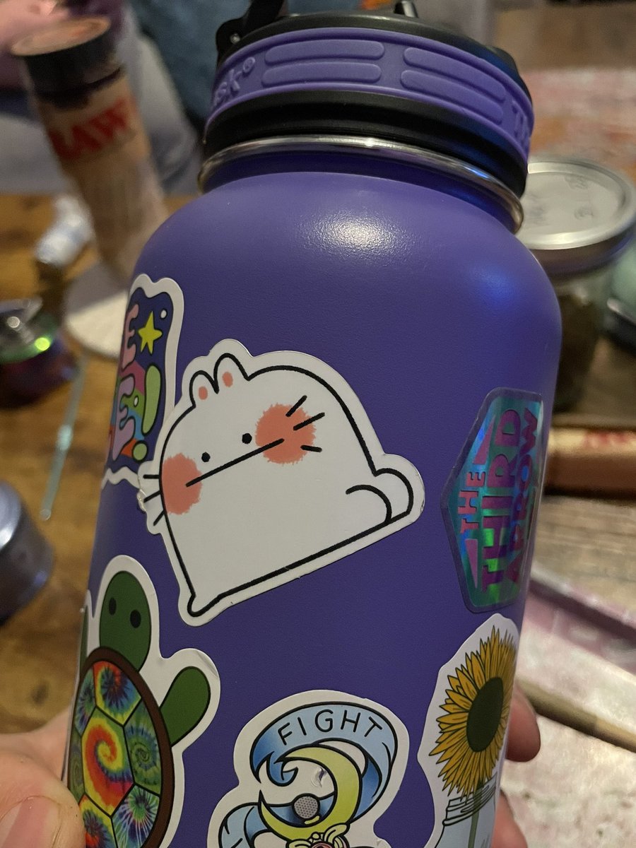 wratherton's tweet photo. @meganroseruiz My wife and I both love your art. Got myself this print and got her a bunch of stickers which adorn my writing station and her water bottle. Always love to see these little guys. Hope you feel better soon 💜 https://t.co/h368vwZwJO
