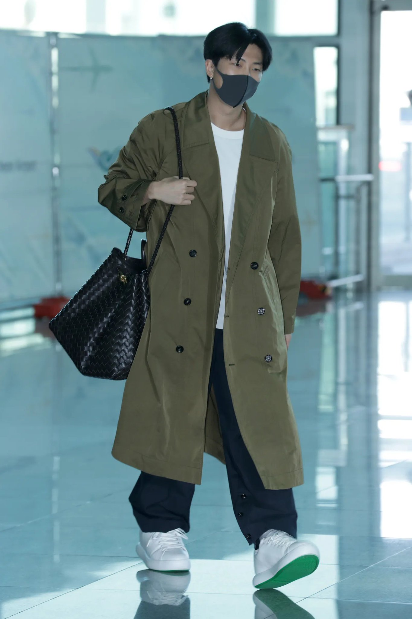 RM is seen wearing Bottega Veneta at the Incheon airport in Seoul