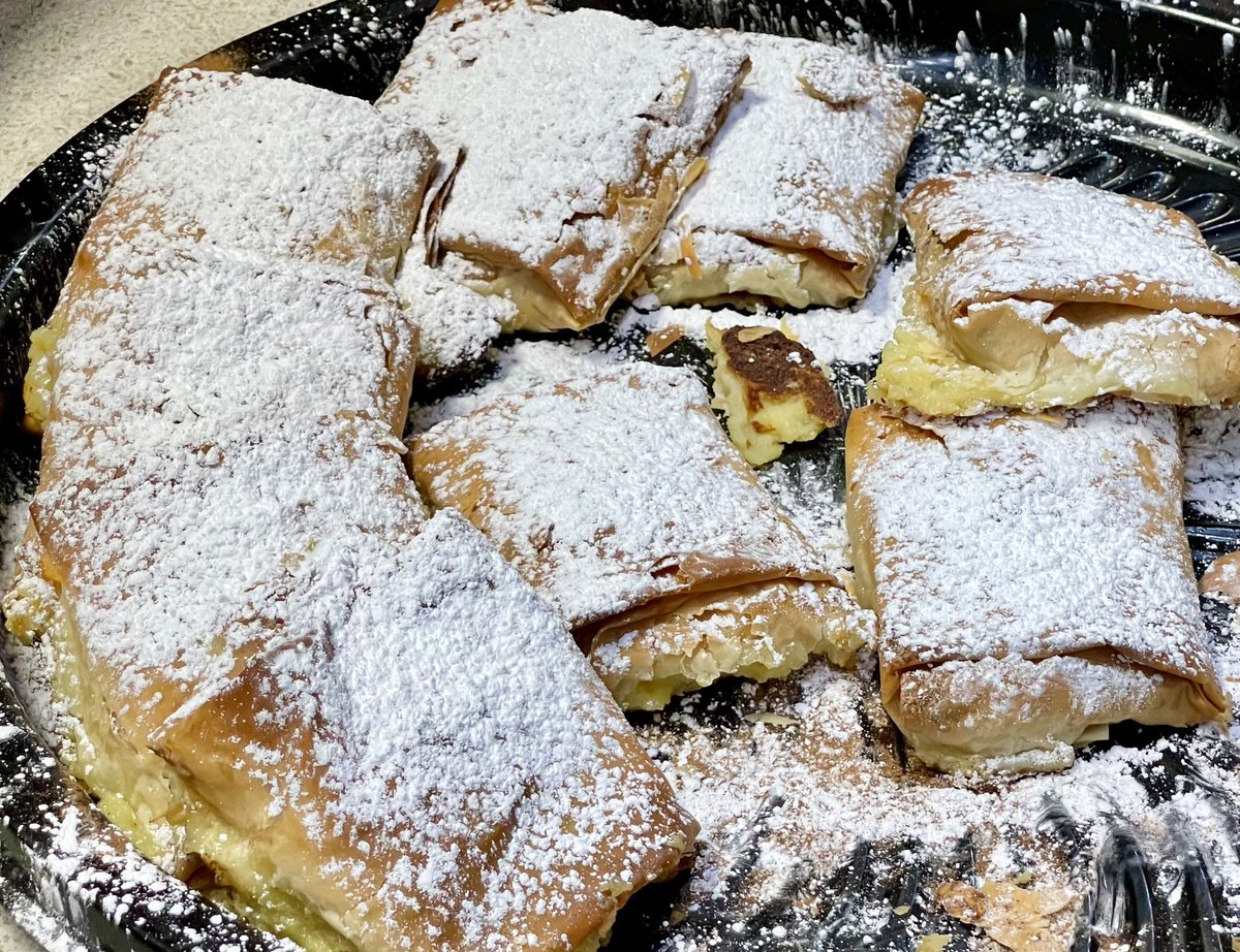 BuffaloFood's tweet photo. Never had bougatsa, Greek custard in folded phyllo, dusted with powdered sugar? The gods have smiled upon you this Buffalo day. For new @broadwaymkt vendor That Greek Guy has $5 bougatsa baked fresh onsite at 999 Broadway. See menu at https://t.co/AQ9p65UyTI #ThisIsGuildWork https://t.co/9Ih64onKQ1