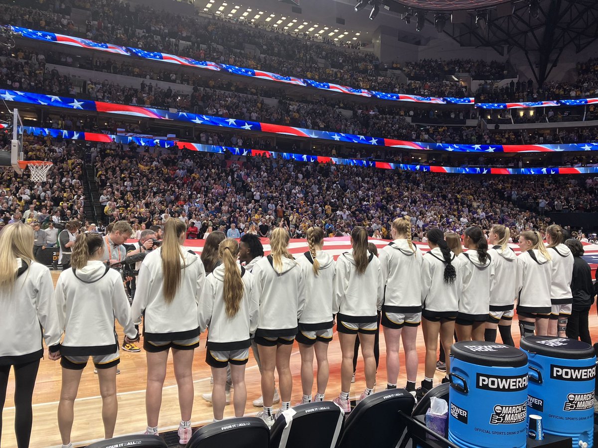 One team is on the floor for the anthem.
